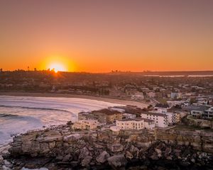 Preview wallpaper city, aerial view, coast, sunset, sea, beach, buildings