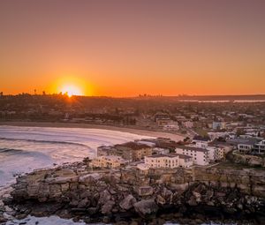 Preview wallpaper city, aerial view, coast, sunset, sea, beach, buildings