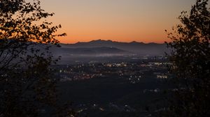 Preview wallpaper city, aerial view, mountains, sunset