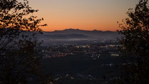 Preview wallpaper city, aerial view, mountains, sunset