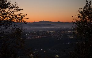 Preview wallpaper city, aerial view, mountains, sunset