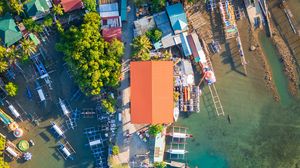 Preview wallpaper city, aerial view, roofs, coast