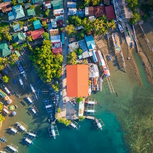 Preview wallpaper city, aerial view, roofs, coast