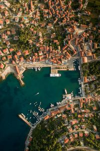 Preview wallpaper city, aerial view, roofs, coast, port