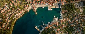 Preview wallpaper city, aerial view, roofs, coast, port