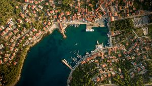 Preview wallpaper city, aerial view, roofs, coast, port