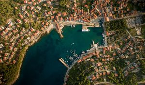 Preview wallpaper city, aerial view, roofs, coast, port
