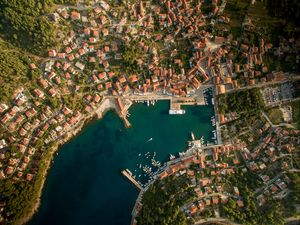 Preview wallpaper city, aerial view, roofs, coast, port