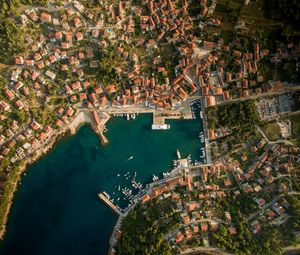 Preview wallpaper city, aerial view, roofs, coast, port