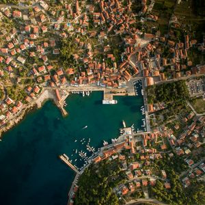 Preview wallpaper city, aerial view, roofs, coast, port