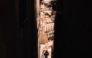 Preview wallpaper city, alleyway, dark, buildings, architecture, view