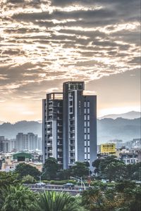 Preview wallpaper city, architecture, buildings, hills, fog