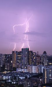 Preview wallpaper city, architecture, buildings, lightning, evening