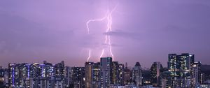 Preview wallpaper city, architecture, buildings, lightning, evening