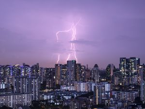 Preview wallpaper city, architecture, buildings, lightning, evening
