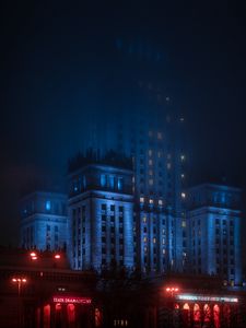 Preview wallpaper city, architecture, tower, buildings, evening, glow