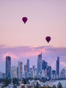 Preview wallpaper city, balloon, sunset, buildings