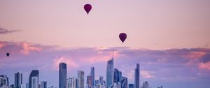 Preview wallpaper city, balloon, sunset, buildings