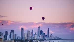 Preview wallpaper city, balloon, sunset, buildings