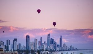 Preview wallpaper city, balloon, sunset, buildings