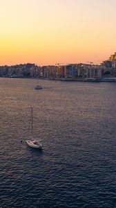 Preview wallpaper city, boats, buildings, water, dusk