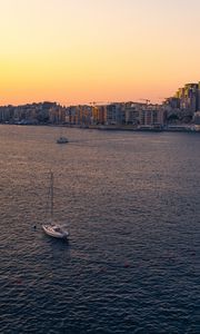 Preview wallpaper city, boats, buildings, water, dusk