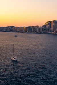 Preview wallpaper city, boats, buildings, water, dusk