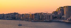 Preview wallpaper city, boats, buildings, water, dusk