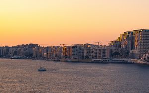 Preview wallpaper city, boats, buildings, water, dusk