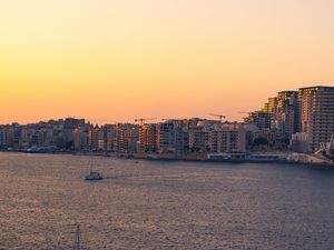 Preview wallpaper city, boats, buildings, water, dusk