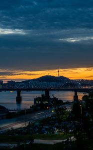 Preview wallpaper city, bridge, river, road, hill, evening, twilight