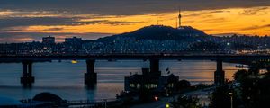 Preview wallpaper city, bridge, river, road, hill, evening, twilight