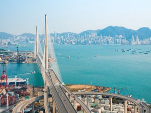 Preview wallpaper city, bridge, road, architecture, ocean, mountains