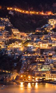 Preview wallpaper city, buildings, aerial view, lights, coast, hilly