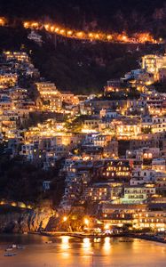 Preview wallpaper city, buildings, aerial view, lights, coast, hilly