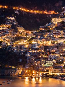 Preview wallpaper city, buildings, aerial view, lights, coast, hilly