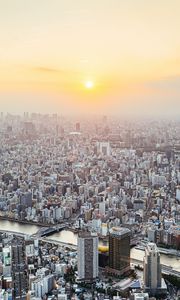 Preview wallpaper city, buildings, aerial view, fog, metropolis, dawn