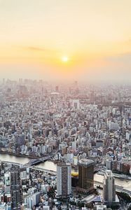 Preview wallpaper city, buildings, aerial view, fog, metropolis, dawn