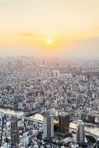 Preview wallpaper city, buildings, aerial view, fog, metropolis, dawn