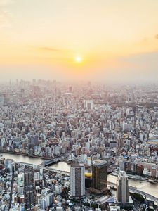 Preview wallpaper city, buildings, aerial view, fog, metropolis, dawn