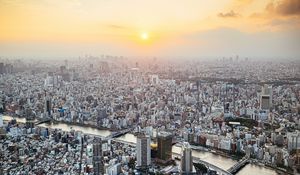 Preview wallpaper city, buildings, aerial view, fog, metropolis, dawn