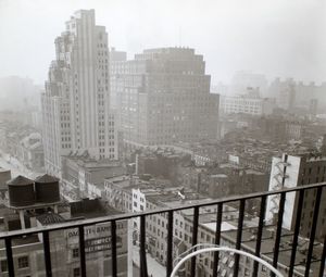 Preview wallpaper city, buildings, aerial view, fog, bw