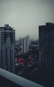 Preview wallpaper city, buildings, aerial view, fog, dusk