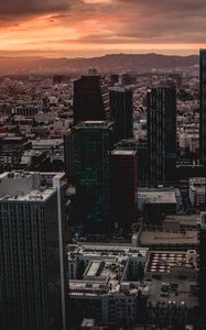 Preview wallpaper city, buildings, aerial view, sunset, horizon
