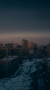 Preview wallpaper city, buildings, aerial view, dusk, snow, winter