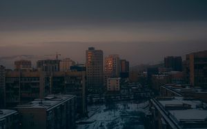 Preview wallpaper city, buildings, aerial view, dusk, snow, winter