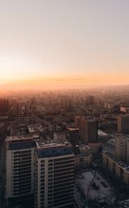 Preview wallpaper city, buildings, aerial view, horizon, fog, dawn
