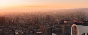 Preview wallpaper city, buildings, aerial view, horizon, fog, dawn