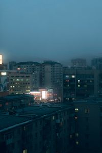 Preview wallpaper city, buildings, aerial view, lights, twilight, fog