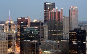 Preview wallpaper city, buildings, aerial view, lights, twilight
